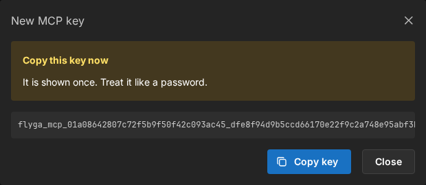 Copy this key now dialog with the flyga_mcp secret